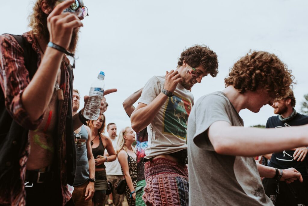 group of hippies during daytime